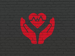 Image showing Insurance concept: Heart And Palm on wall background