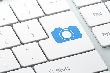 Image showing Vacation concept: Photo Camera on computer keyboard background