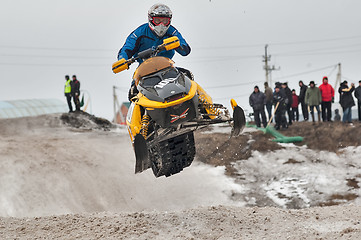 Image showing High jump of sportsman on snowmobile