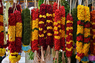 Image showing Flower garlands and basket of flower used for hinduism religion