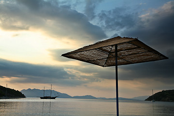 Image showing Parasol on a beach in the Peloponese in greece in the summer