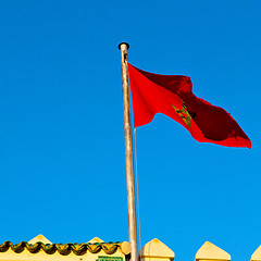 Image showing tunisia  waving flag in the blue sky  colour and battlements  wa