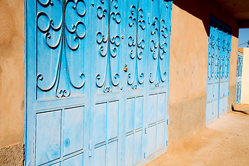 Image showing blue morocco old door and historical nail wood