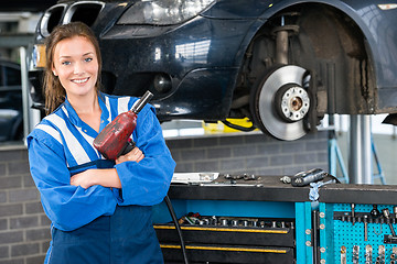 Image showing Mechanic With Pneumatic Wrench Standing By Car