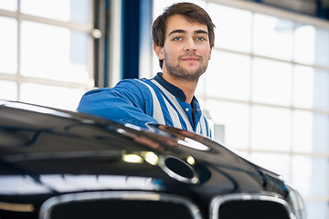 Image showing Mechanic Discussing With Female Customer In Garage