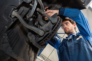 Image showing Mechanic Repairing Car In Automobile Shop