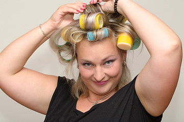 Image showing Woman with curler