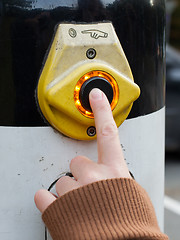 Image showing Hand pushing button for traffic light