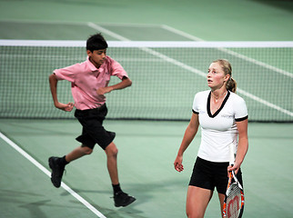 Image showing Ekaterina Makarova and ball boy, Doha, Qatar, 2008