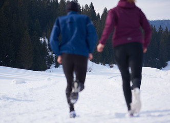 Image showing couple jogging outside on snow