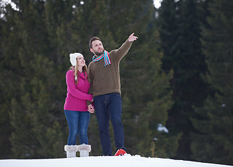 Image showing couple having fun and walking in snow shoes