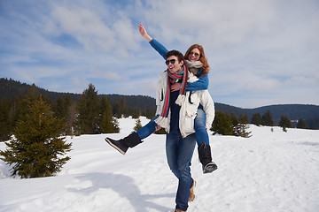 Image showing happy young couple having fun on fresh show on winter vacation