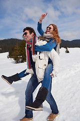 Image showing happy young couple having fun on fresh show on winter vacation