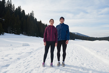 Image showing couple jogging outside on snow