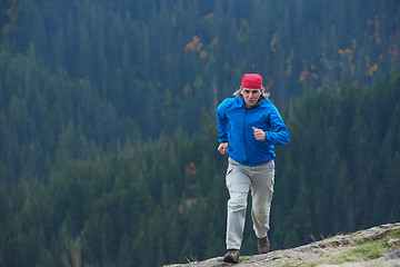 Image showing advanture man with backpack hiking