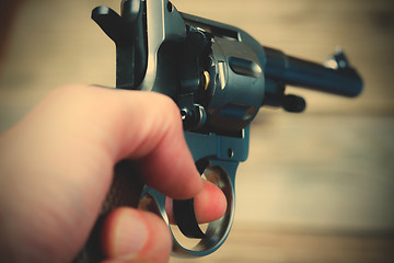 Image showing revolver in a human hand