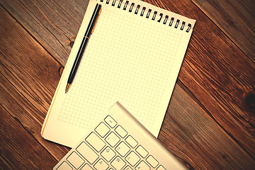 Image showing Computer keyboard, notebook and pen