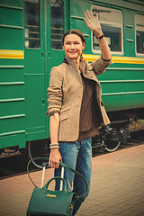 Image showing beautiful middle-aged woman waving good-bye