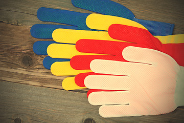 Image showing four colored construction gloves