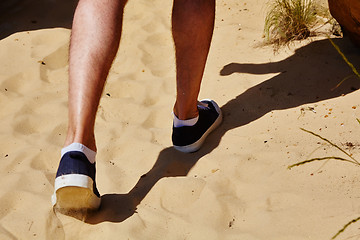 Image showing Close up fashion image of man walking alone