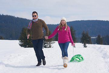 Image showing happy young couple having fun on fresh show on winter vacation