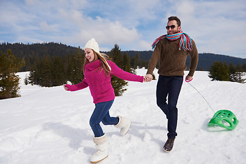 Image showing happy young couple having fun on fresh show on winter vacation