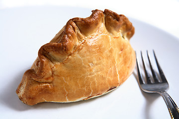 Image showing Cornish pasty, fork, white plate