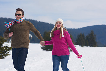 Image showing happy young couple having fun on fresh show on winter vacation