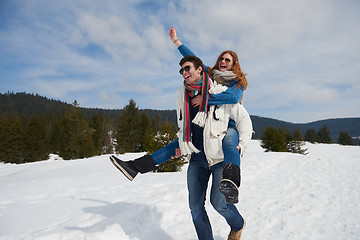 Image showing happy young couple having fun on fresh show on winter vacation