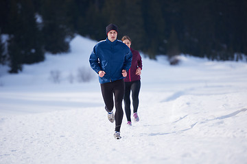 Image showing couple jogging outside on snow