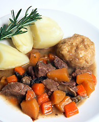 Image showing English stew, dumplings and potatoes with rosemary