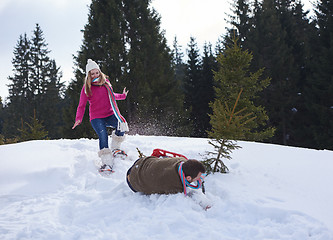 Image showing couple having fun and walking in snow shoes