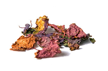 Image showing colorful dried patchouli leaves over white