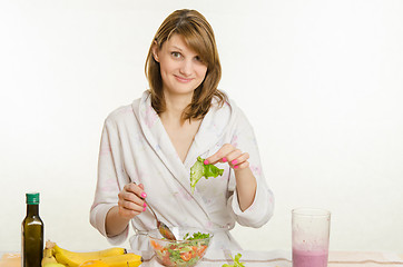 Image showing Surprised young girl found in a vegetarian salad leaf green nedorezanny