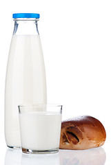 Image showing Milk and bun with poppy seeds