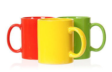 Image showing Three colorful mugs for coffee or tea