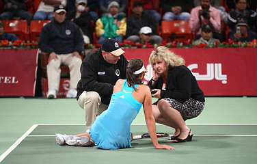 Image showing Ana Ivanovic gets help after fall at Qatar Open