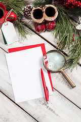 Image showing The blank sheet of paper on the wooden table with a pen 