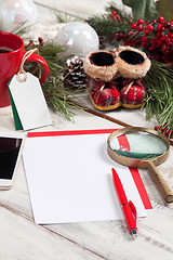 Image showing The blank sheet of paper on the wooden table with a pen 