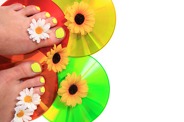 Image showing women feets and flowers (pedicure tbackground)