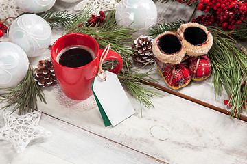 Image showing The a cup of coffee on the wooden table 