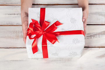 Image showing The wooden table with Christmas gift