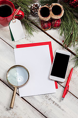 Image showing The blank sheet of paper on the wooden table with a pen 