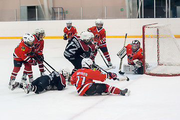 Image showing Game near gate. Children ice-hockey