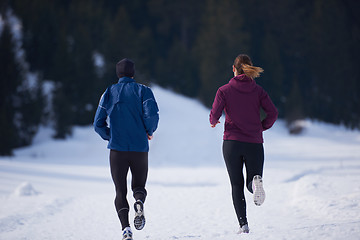 Image showing couple jogging outside on snow