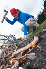 Image showing hiking man try to light fire