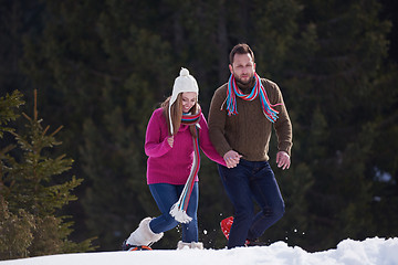 Image showing couple having fun and walking in snow shoes