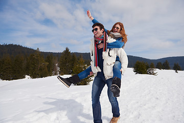 Image showing happy young couple having fun on fresh show on winter vacation