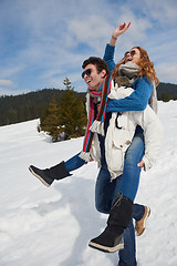 Image showing happy young couple having fun on fresh show on winter vacation