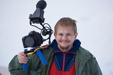 Image showing couple having fun and walking in snow shoes